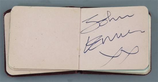 The Beatles: A small red leather bound autograph album with assorted autographs 2.5 x 2.75in.